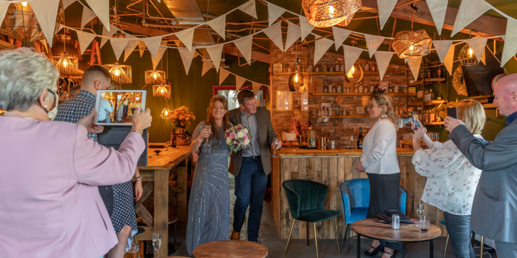Wedding at The Shed with bride, groom and guests | Shed 1 Distillery, Ulverston