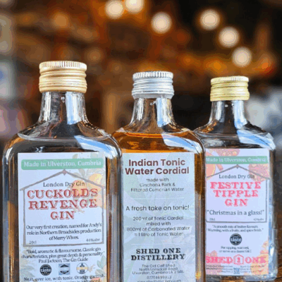 Three bottles: 2 gins and 1 cordial